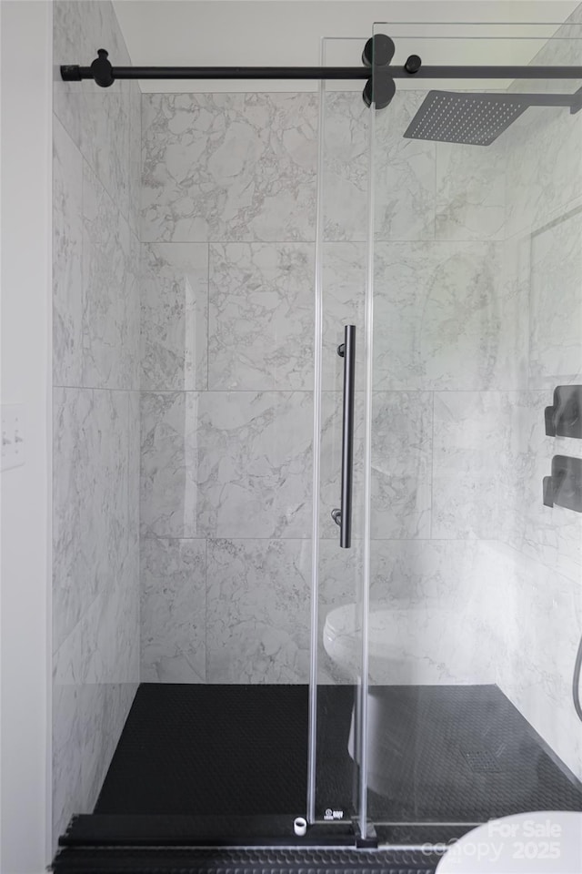 full bathroom with a shower stall