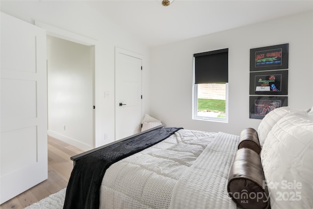 bedroom featuring light wood finished floors