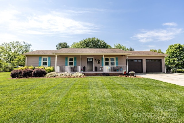 ranch-style house featuring a porch, a front lawn, an attached garage, and concrete driveway