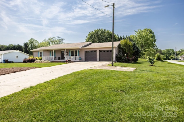 ranch-style home featuring an attached garage, a front lawn, covered porch, and driveway