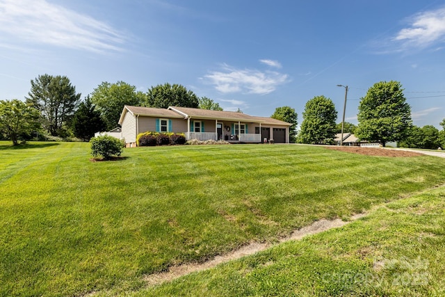 ranch-style house with a garage and a front lawn