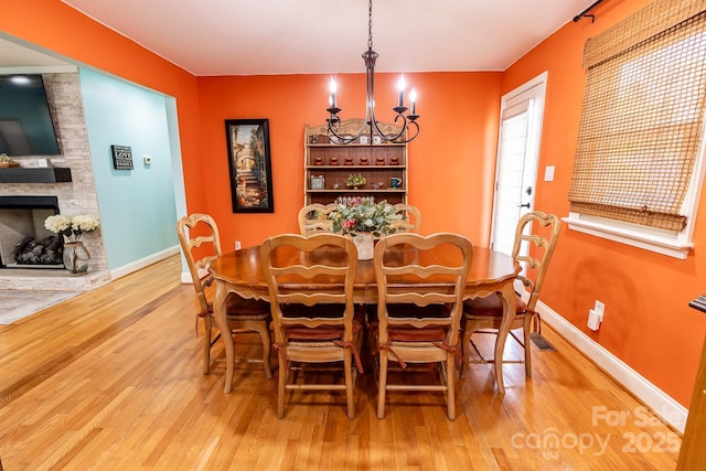 dining area featuring baseboards and wood finished floors