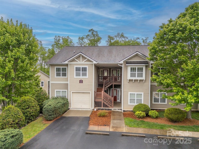 20 Foxden Dr Unit 301, Fletcher, NC 28732 - view of front facade with an attached garage, stairs, and aphalt driveway
