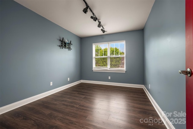 20 Foxden Dr Unit 301, Fletcher, NC 28732 - unfurnished dining area featuring track lighting, dark wood finished floors, and baseboards