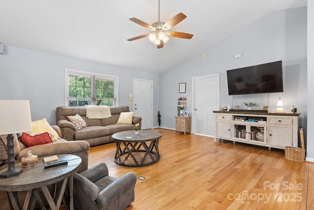 living area with a ceiling fan, high vaulted ceiling, and light wood-style floors