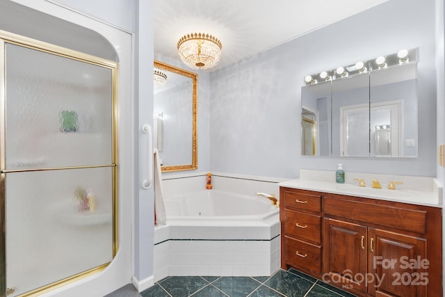 bathroom featuring a notable chandelier, vanity, tile patterned floors, a bath, and a stall shower