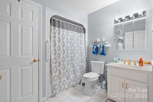 bathroom featuring tile patterned floors, vanity, toilet, and curtained shower