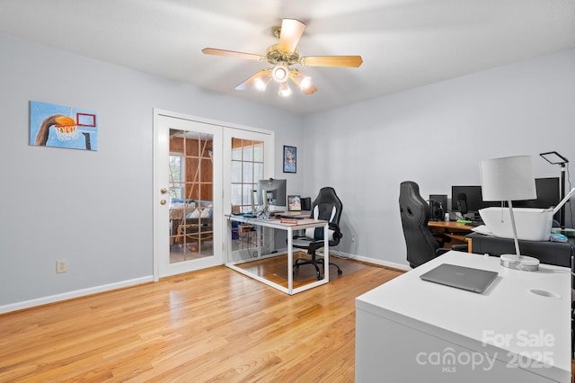 office space with a ceiling fan, baseboards, french doors, and light wood finished floors