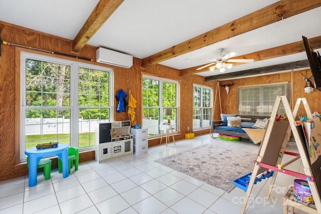 game room with tile patterned floors, beamed ceiling, an AC wall unit, and wood walls