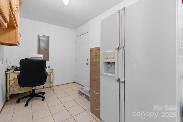 home office with baseboards, a textured ceiling, light tile patterned flooring, and electric panel