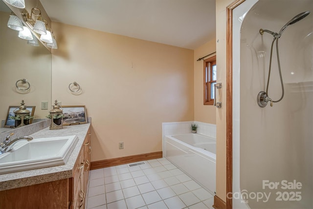 full bath featuring walk in shower, vanity, visible vents, and tile patterned flooring