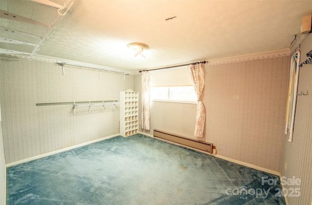 interior space featuring baseboards, a baseboard radiator, and carpet