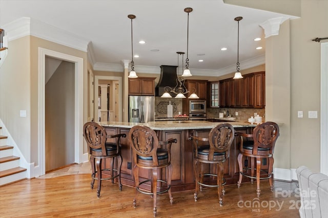 8904 Woodhall Lake Dr, Waxhaw, NC 28173 - kitchen featuring light stone countertops, light wood-style floors, baseboards, tasteful backsplash, and stainless steel appliances