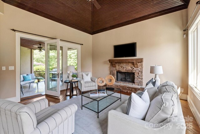 8904 Woodhall Lake Dr, Waxhaw, NC 28173 - living room featuring high vaulted ceiling, a healthy amount of sunlight, and wood finished floors