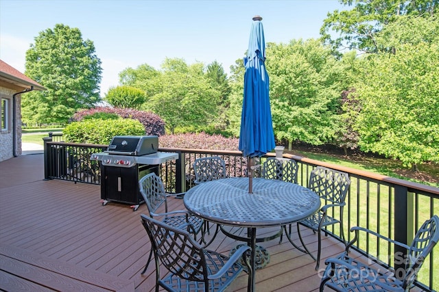 8904 Woodhall Lake Dr, Waxhaw, NC 28173 - wooden deck with outdoor dining area, a yard, and area for grilling