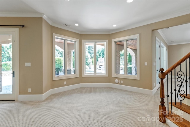 8904 Woodhall Lake Dr, Waxhaw, NC 28173 - carpeted foyer entrance with baseboards, a wealth of natural light, ornamental molding, and visible vents