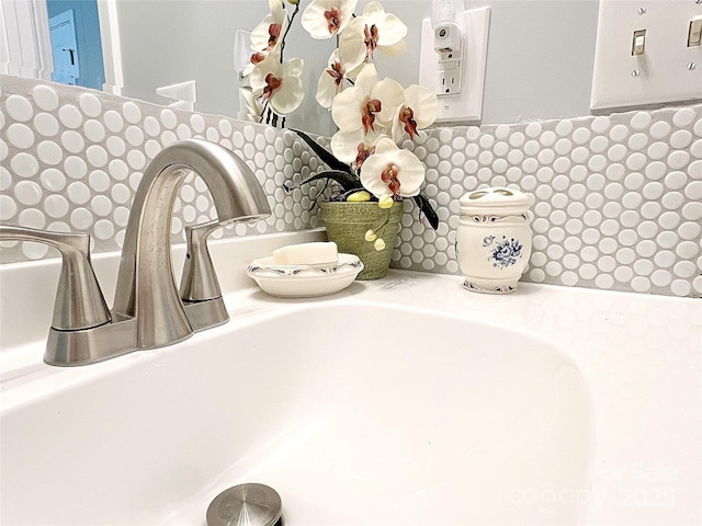 room details with a sink and decorative backsplash