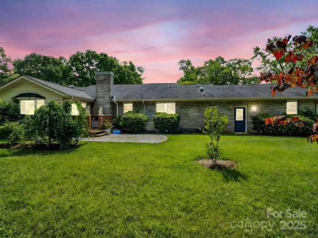 209 Daniel Dr, Hendersonville, NC 28739 - single story home with a chimney, a lawn, and a patio