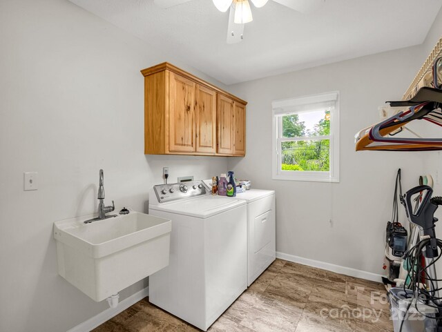 209 Daniel Dr, Hendersonville, NC 28739 - clothes washing area with washer and dryer, cabinet space, baseboards, and a ceiling fan