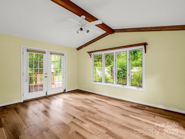209 Daniel Dr, Hendersonville, NC 28739 - spare room with wood finished floors, baseboards, a ceiling fan, and french doors