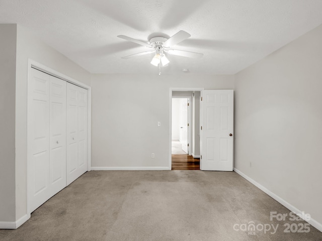 209 Daniel Dr, Hendersonville, NC 28739 - unfurnished bedroom with carpet flooring, baseboards, a closet, and ceiling fan