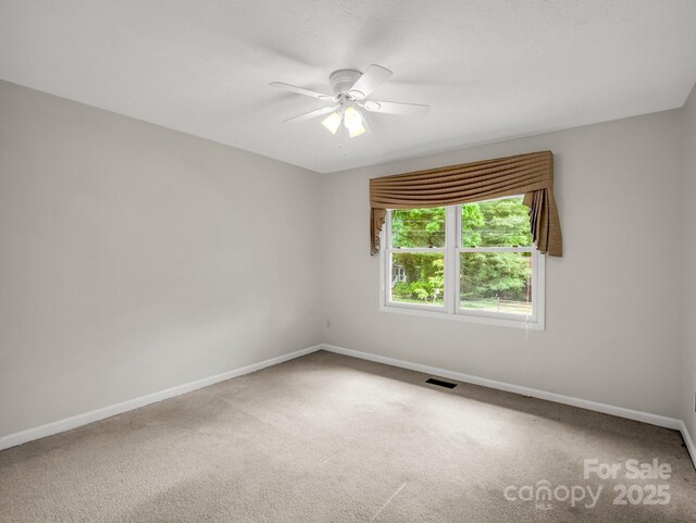 209 Daniel Dr, Hendersonville, NC 28739 - spare room with carpet floors, baseboards, and a ceiling fan