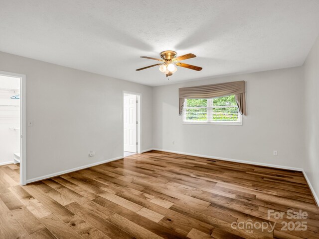 209 Daniel Dr, Hendersonville, NC 28739 - unfurnished room featuring wood finished floors, ceiling fan, and baseboards