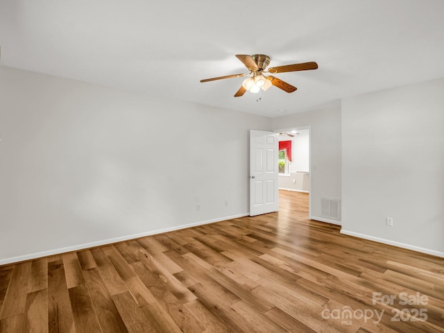 209 Daniel Dr, Hendersonville, NC 28739 - empty room featuring a ceiling fan, wood finished floors, and baseboards