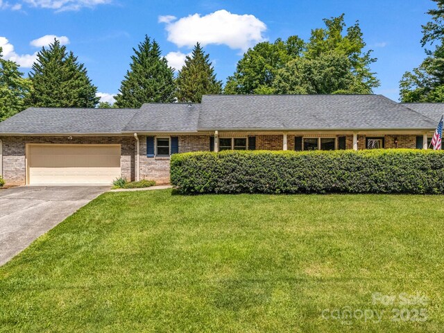 209 Daniel Dr, Hendersonville, NC 28739 - ranch-style house with a front yard, a garage, brick siding, concrete driveway, and roof with shingles