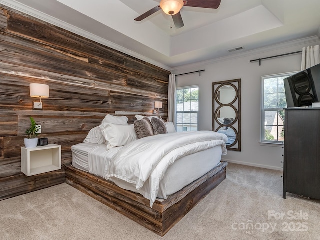 2125 Belle Vernon Ave, Charlotte, NC 28210 - bedroom with light carpet, a tray ceiling, wood walls, a ceiling fan, and baseboards