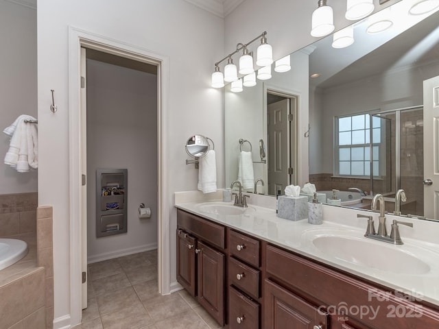 2125 Belle Vernon Ave, Charlotte, NC 28210 - bathroom featuring ornamental molding, tile patterned floors, a bath, double vanity, and a stall shower