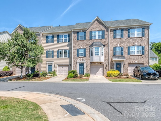 2125 Belle Vernon Ave, Charlotte, NC 28210 - townhome / multi-family property with a garage and driveway