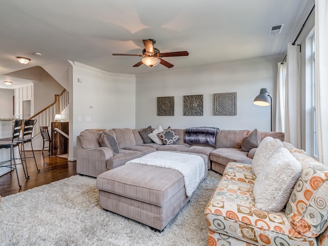 2125 Belle Vernon Ave, Charlotte, NC 28210 - living area with stairway, a ceiling fan, wood finished floors, and ornamental molding