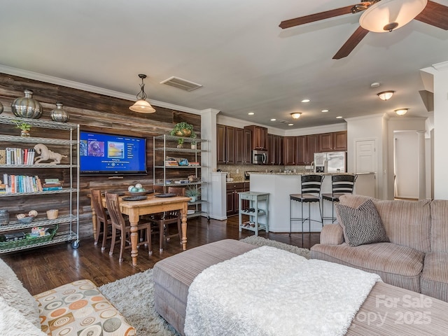 2125 Belle Vernon Ave, Charlotte, NC 28210 - living area featuring a ceiling fan, dark wood finished floors, recessed lighting, and ornamental molding