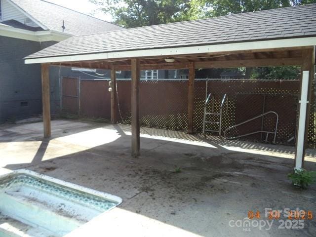 view of patio / terrace featuring fence