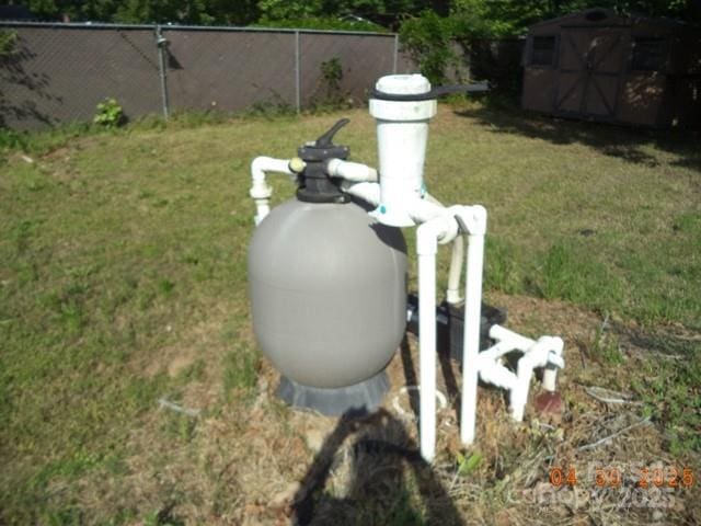 exterior details with fence and pump