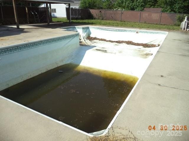 view of pool with fence, a fenced in pool, and a patio