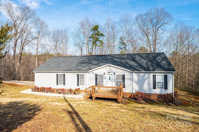 manufactured / mobile home with crawl space, a shingled roof, a front yard, and a wooden deck