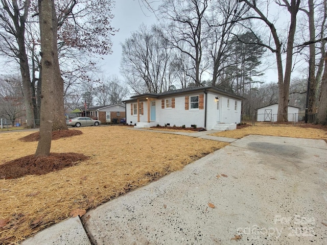 view of front of house with a front yard and brick siding