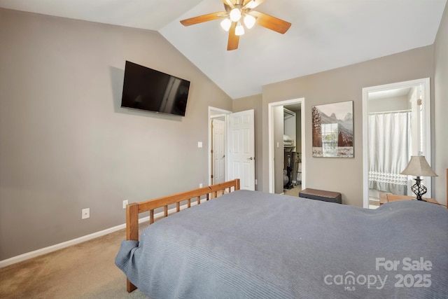 carpeted bedroom featuring baseboards, a ceiling fan, vaulted ceiling, and a spacious closet
