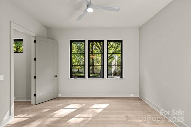 624 Heather Ln, Charlotte, NC 28209 - empty room featuring wood finished floors, a ceiling fan, and baseboards