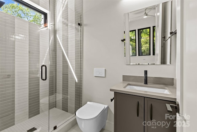 624 Heather Ln, Charlotte, NC 28209 - bathroom featuring healthy amount of natural light, a shower stall, vanity, and toilet