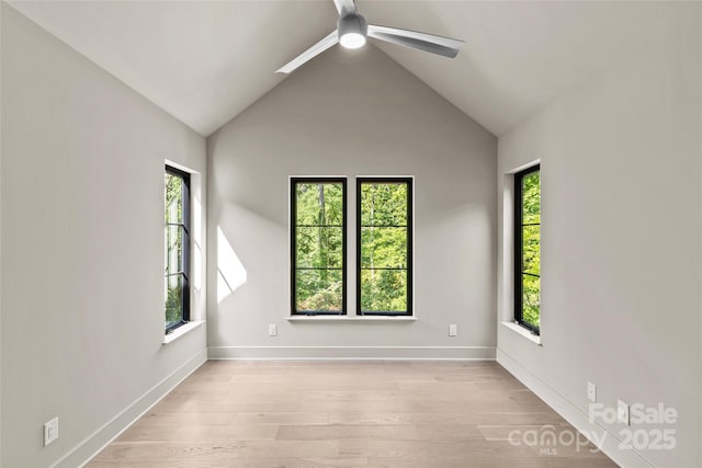 624 Heather Ln, Charlotte, NC 28209 - empty room with a ceiling fan, light wood-style floors, vaulted ceiling, and baseboards