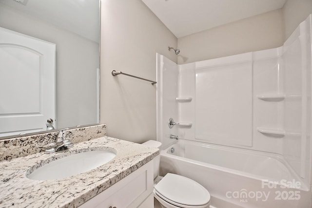 bathroom featuring toilet, washtub / shower combination, and vanity