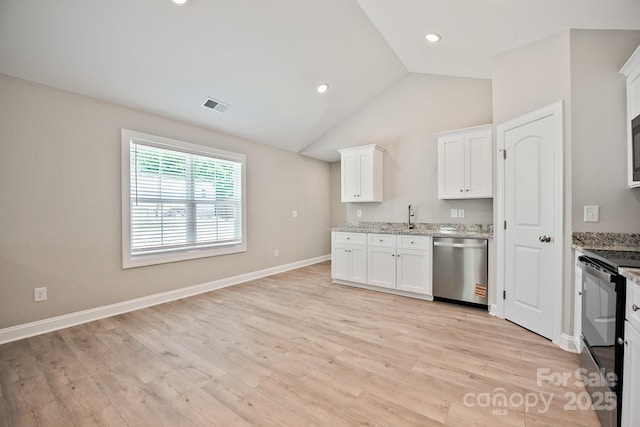 kitchen featuring stainless steel dishwasher, white cabinetry, visible vents, and light wood-style flooring