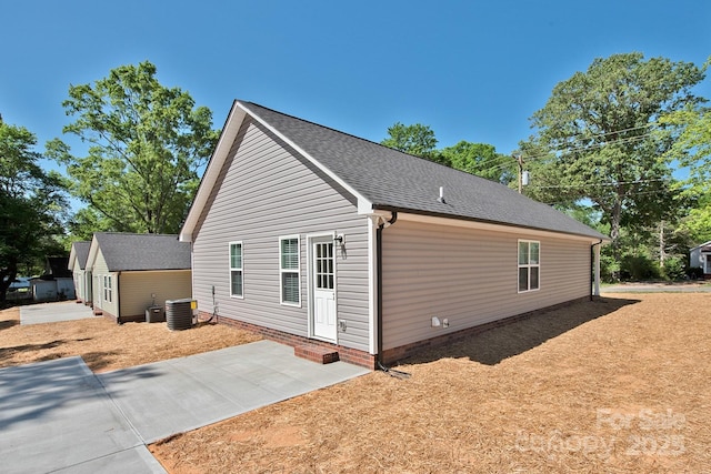 view of side of property featuring entry steps and a patio area