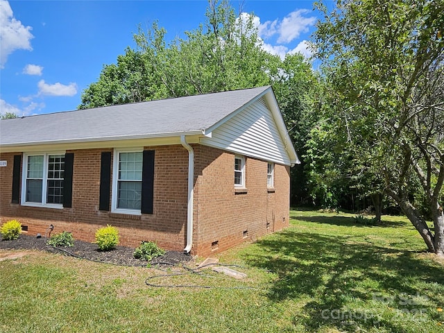 1109 Reid Harkey Rd, Matthews, NC 28105 - view of property exterior featuring crawl space, brick siding, and a lawn