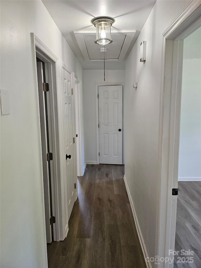 1109 Reid Harkey Rd, Matthews, NC 28105 - hallway with dark wood-style floors, attic access, and baseboards