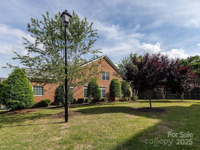 140 Villa Lake Dr, Fort Mill, SC 29708 - view of home's exterior with brick siding and a yard