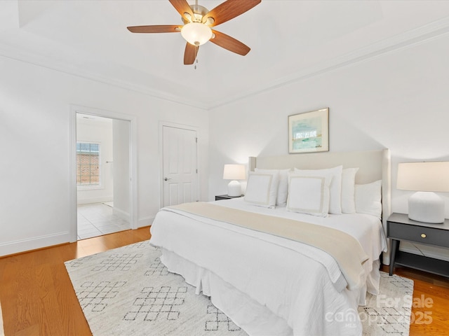 140 Villa Lake Dr, Fort Mill, SC 29708 - bedroom featuring wood finished floors, baseboards, ornamental molding, ceiling fan, and ensuite bathroom